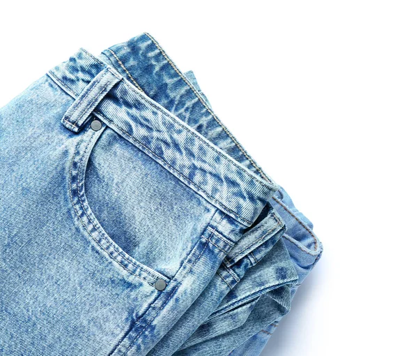 Calça Jeans Dobrada Sobre Fundo Branco Close — Fotografia de Stock