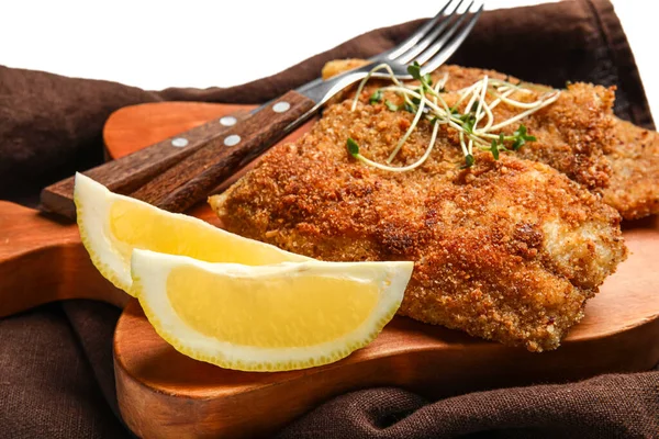 Wooden Board Tasty Fried Codfish Lemon White Background Closeup — Stock Photo, Image