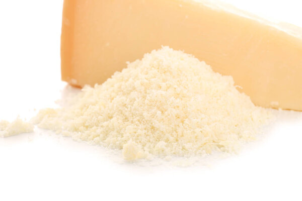 Heap of tasty grated Parmesan cheese on white background