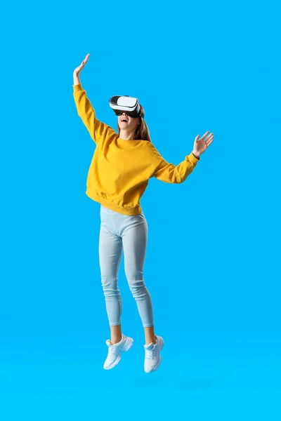 Jumping Young Woman Glasses Blue Background — Stock Photo, Image