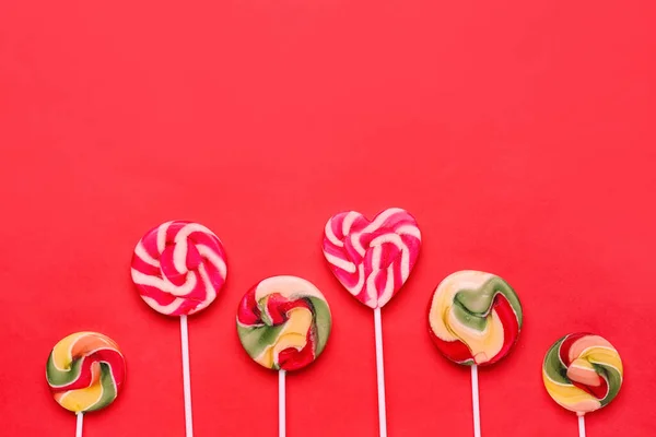 Sweet Lollipops Red Background — Stock Photo, Image