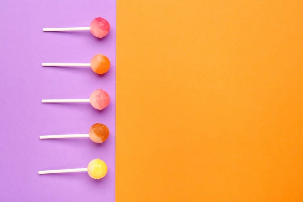 Sweet Lollipops Purple Orange Background — Stock Photo, Image
