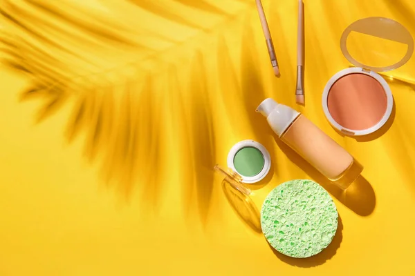 Set Decorative Cosmetics Sponge Palm Leaf Shadow Yellow Background — Stock Photo, Image