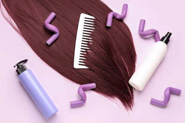 Red brown hair with accessories on pink background