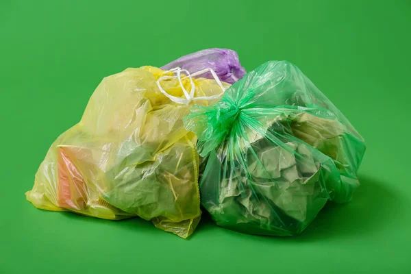 Full Garbage Bags Green Background — Stock Photo, Image