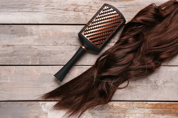 Curled Brown Hair Brush Wooden Background — Stock Photo, Image