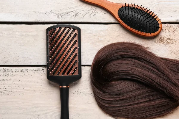 Brown Hair Brushes White Wooden Background — Stock Photo, Image