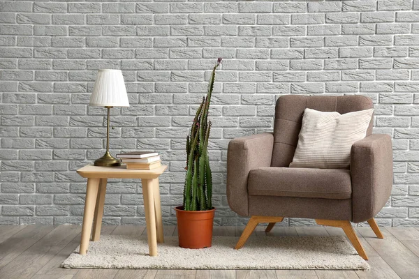Cozy Armchair Pot Cactus Lamp Table Grey Brick Wall — Stock Photo, Image