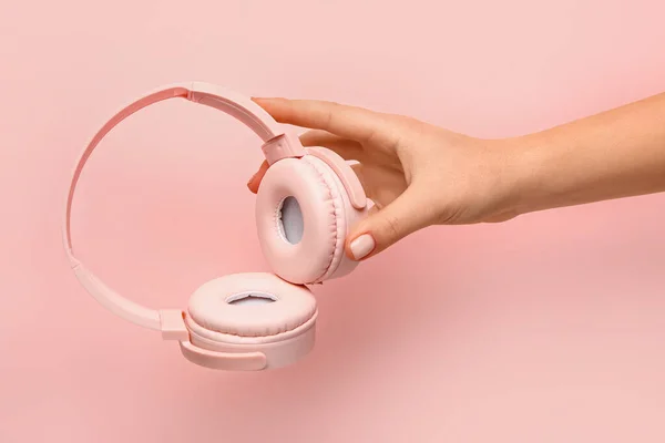 Woman Holding Modern Headphones Pink Background — Stock Photo, Image