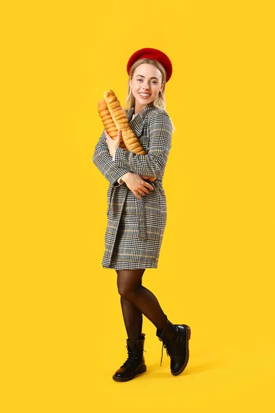 Stylish Young Woman Baguettes Yellow Background — Stock Photo, Image