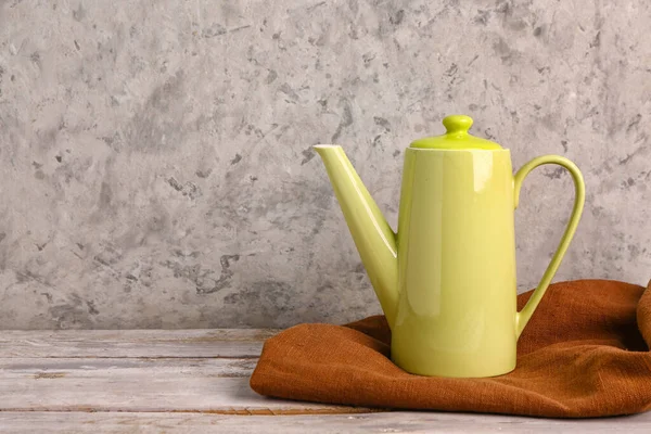 Ceramic Teapot Wooden Table Grunge Wall — Stock Photo, Image
