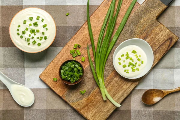 Bowls Tasty Sour Cream Green Onion Table — Stock Photo, Image