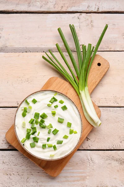 Bowl Tasty Sour Cream Green Onion Light Wooden Background — Stock Photo, Image