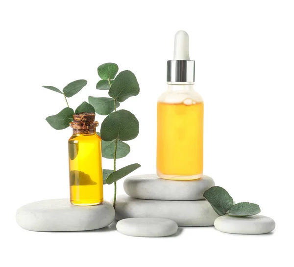 Bottles Cosmetic Oil Eucalyptus Branch Stones White Background — Stock Photo, Image