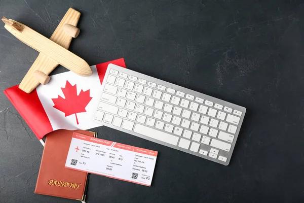 Canadian Flag Wooden Airplane Passport Ticket Computer Keyboard Dark Background — Stock Photo, Image