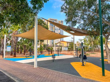 Modern exercise equipment on sport ground in city