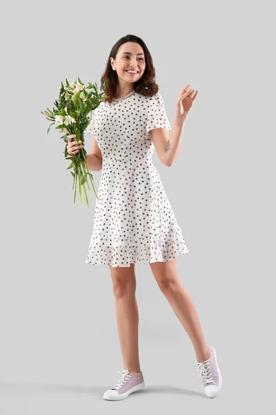 Young Woman Dress Alstroemeria Flowers Grey Background — Stockfoto