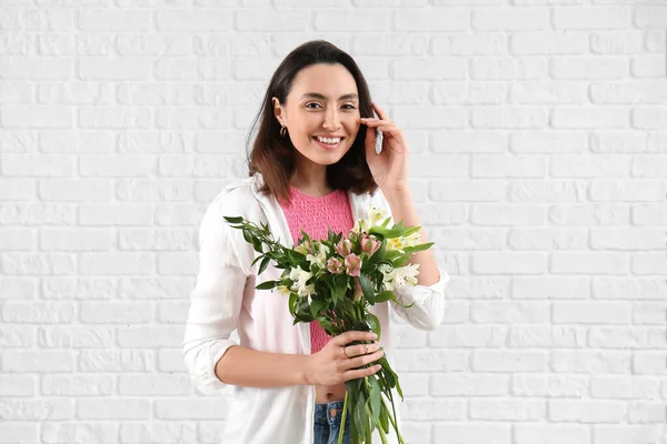 Young Woman Alstroemeria Flowers White Brick Background — Stok fotoğraf