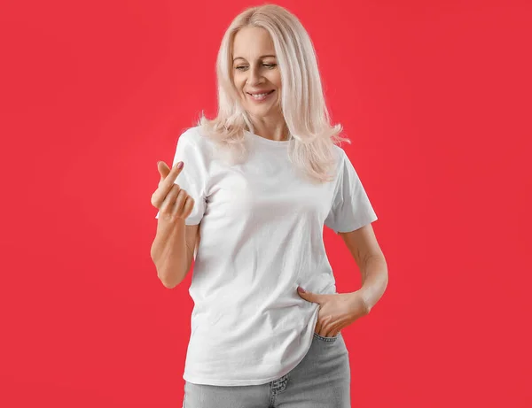 Mature Woman Making Heart Her Fingers Red Background — Stock Photo, Image