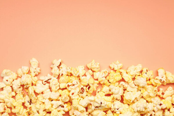 Crispy popcorn on beige background, closeup