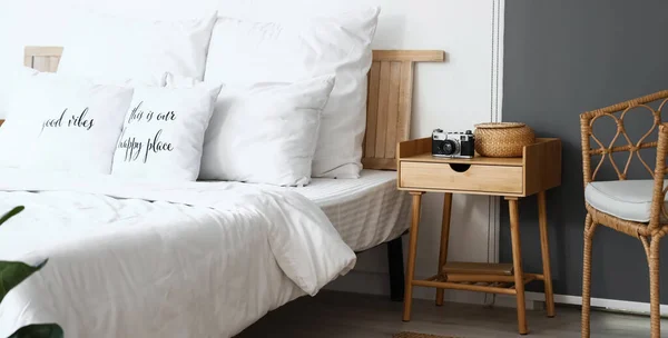 Wooden Nightstand Photo Camera Wicker Basket Light Bedroom — Stock Photo, Image