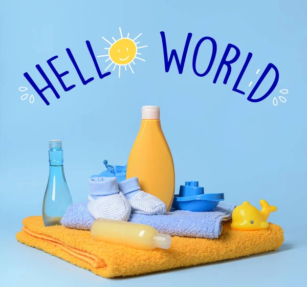 Banner with text HELLO WORLD and baby accessories for bathing