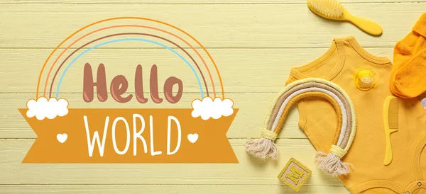 stock image Banner with text HELLO WORLD, baby clothes and accessories