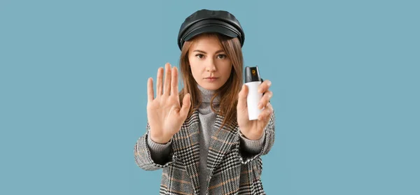 Young Woman Pepper Spray Self Defence Showing Stop Gesture Blue — Fotografia de Stock