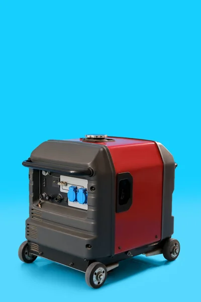 Portable gasoline generator on blue background