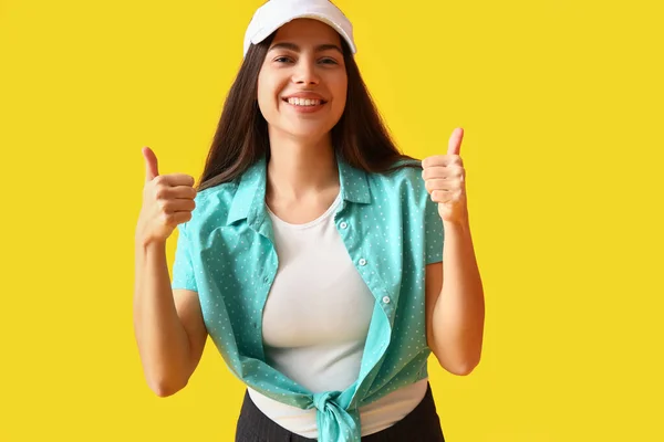 Young Woman Cap Showing Thumbs Yellow Background — Stock Photo, Image