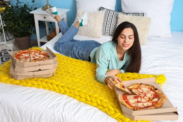 Young Woman Tasty Pizza Lying Bedroom — Foto de Stock