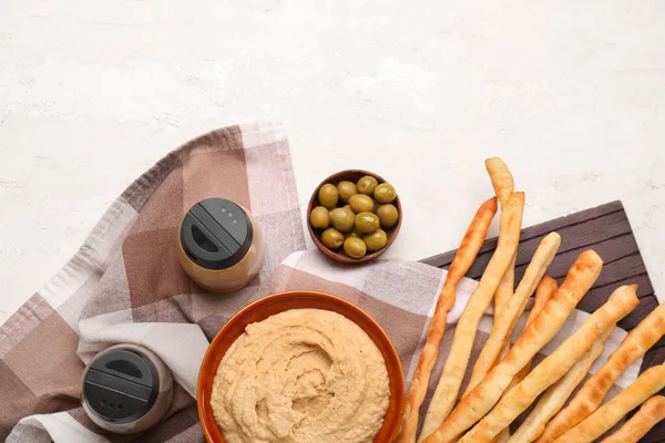 Bowl Tasty Hummus Italian Grissini Light Background — Stock Photo, Image