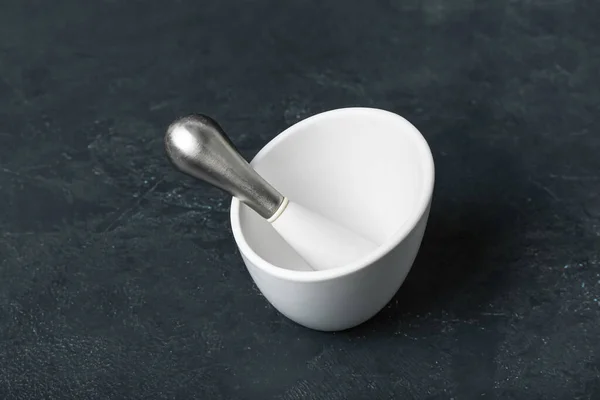 Mortar and pestle on dark background