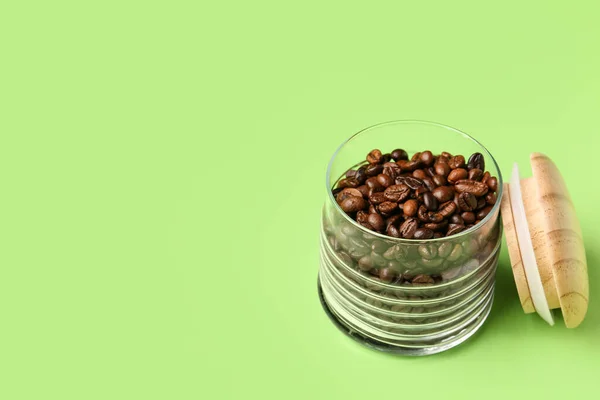 Glass Jar Coffee Beans Green Background —  Fotos de Stock