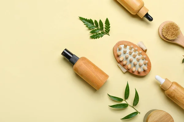Bottles Cosmetic Oil Plant Twigs Massage Brushes Beige Background — Stock Photo, Image