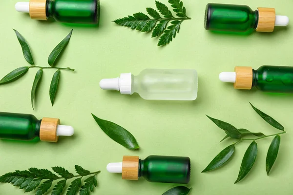 Bottles Cosmetic Oil Plant Twigs Light Green Background — Stock Photo, Image