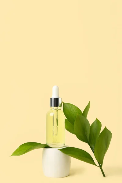 Bottle Cosmetic Oil Plant Twig Stand Yellow Background — Stock Photo, Image