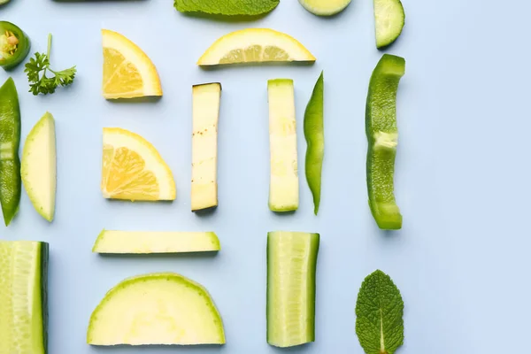 stock image Composition with green fresh fruits and vegetables on blue background