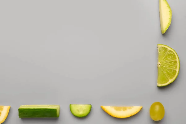 stock image Frame made of fruits and vegetables on grey background