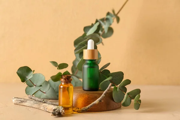 Bottles Cosmetic Oil Eucalyptus Branch Orange Background — Stock Photo, Image