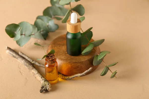 Bottles Cosmetic Oil Eucalyptus Branch Orange Background — Stock Photo, Image