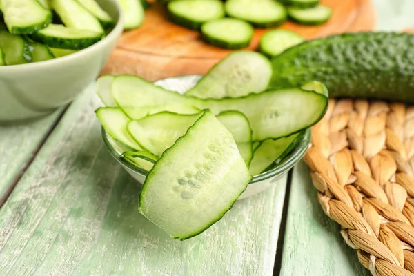 Bowl Slices Fresh Cucumber Light Wooden Background — Stock Photo, Image