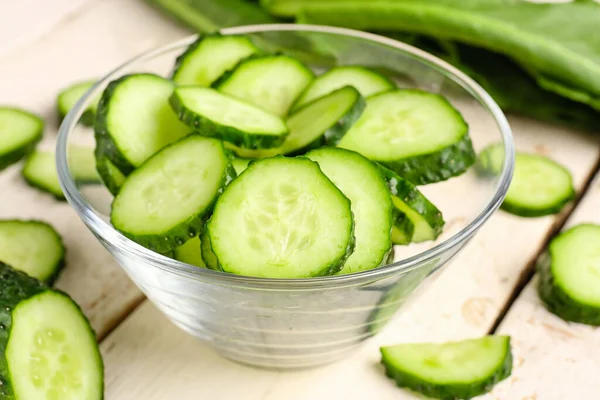 Bowl Pieces Fresh Cucumber Light Wooden Background — Stock Photo, Image