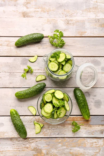 Jar Bowl Fresh Cut Cucumbers Light Wooden Background — Stock Photo, Image