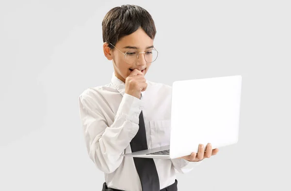 Little Schoolboy Laptop Biting Nails Grey Background — Stock Fotó