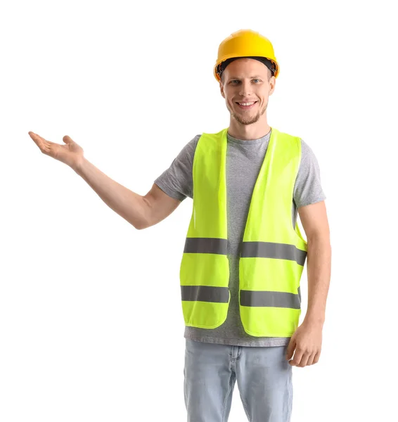 Männlicher Arbeiter Weste Und Hut Zeigt Etwas Auf Weißem Hintergrund — Stockfoto