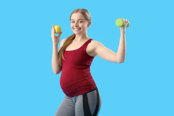 Sporty Pregnant Woman Apple Dumbbell Blue Background — Stock Photo, Image