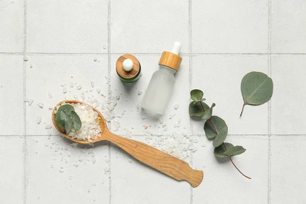 Cosmetic Oil Bottles Wooden Spoon Eucalyptus Branch Sea Salt Tile — Stock Photo, Image