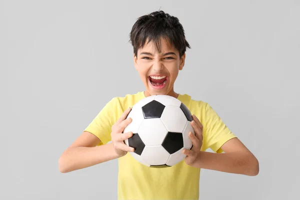 Aggressive Little Boy Soccer Ball Grey Background — Stock Photo, Image