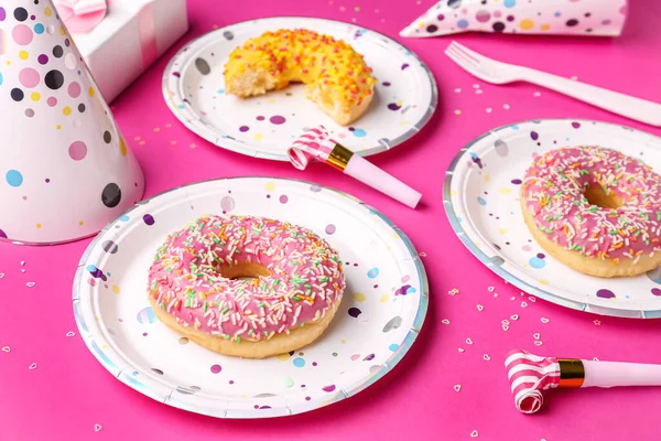 Paper Disposable Plates Donuts Party Blowers Pink Background Closeup — Stock Photo, Image